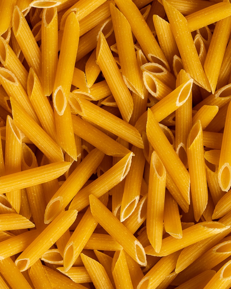 Adrian Crook Cuisine food photography of dried penne pasta
