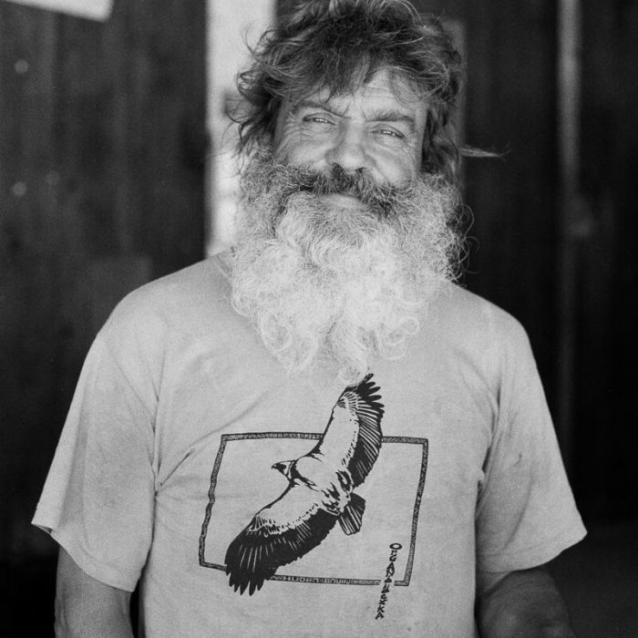 Smiling man shot on film in black and white